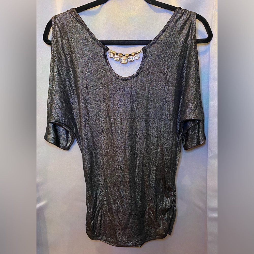 Silver top with cold shoulder cut outs and a bejeweled neckline